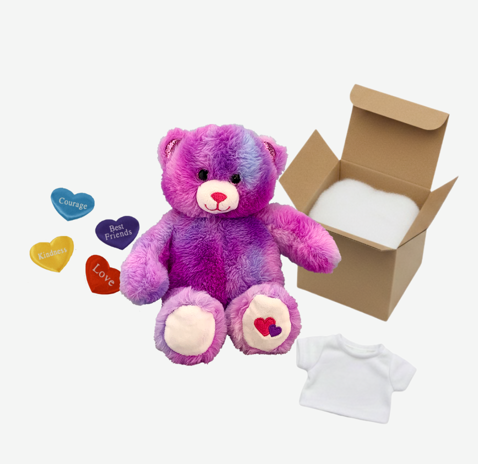 Multicolored teddy bear with a box, t-shirt, and decorative hearts on a white background